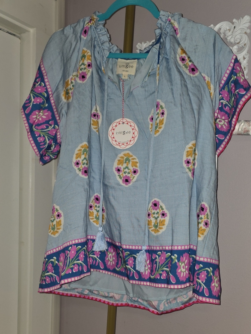 Umgee NWT Light Blue Floral Border Peasant Top with Tassel Ties